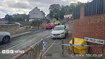 House fire causes disruption to school and road
