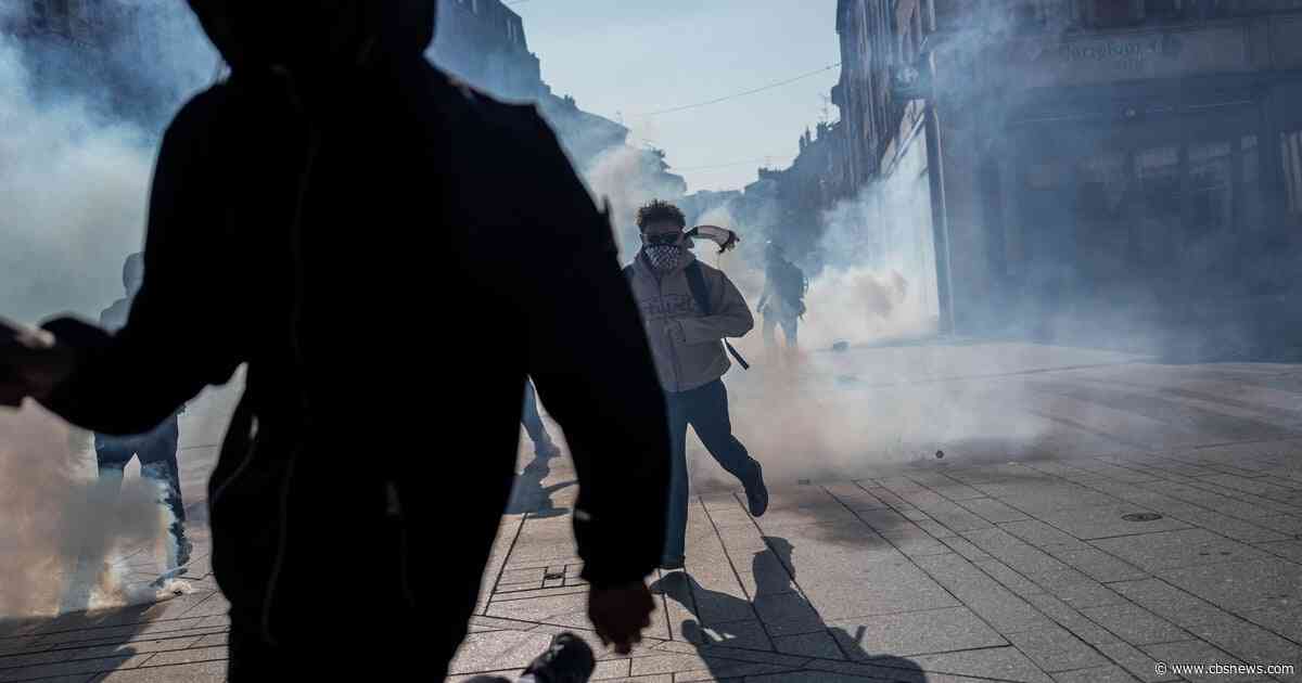 Teenager loses hand picking up grenade in France school protests
