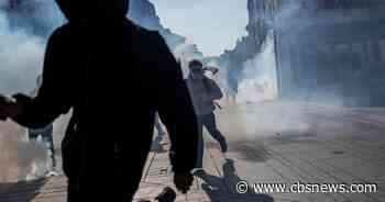 Teenager loses hand picking up grenade in France school protests