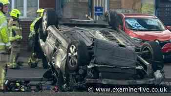 Battered car flipped onto its roof in Dewsbury crash