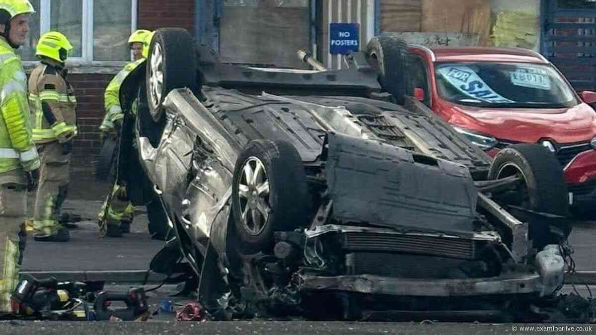 Battered car flipped onto its roof in Dewsbury crash