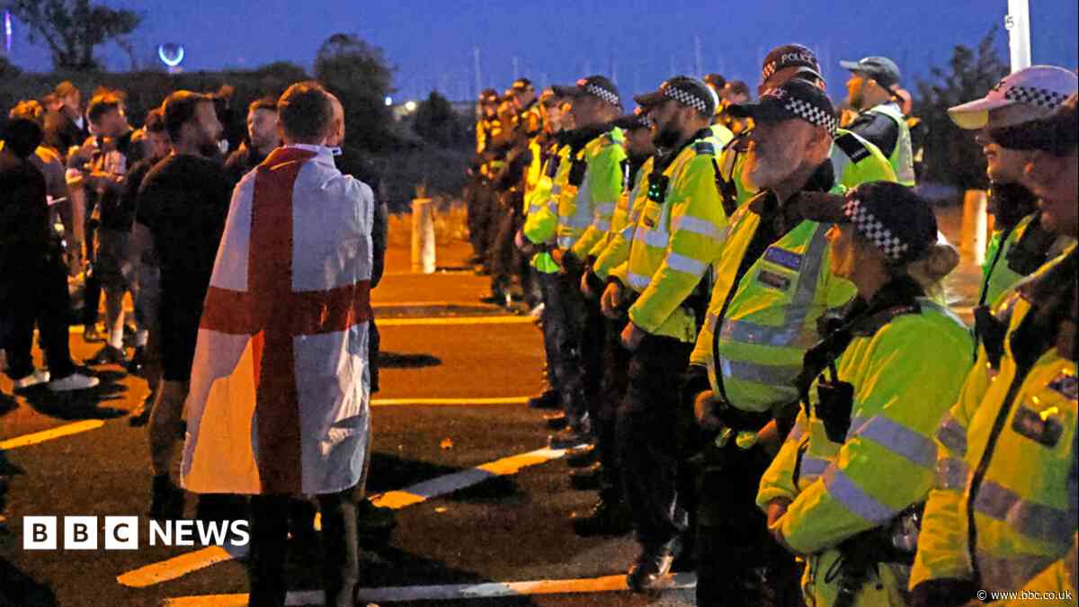 Twelve arrests after protest over migrant boat arrival