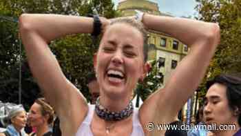 Amber Heard shares jubilant moment she completed her first half marathon in new update from her secluded Spanish life