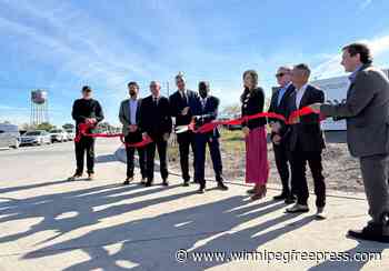 Ribbon cutting marks new roads, buildings start in Water Tower District