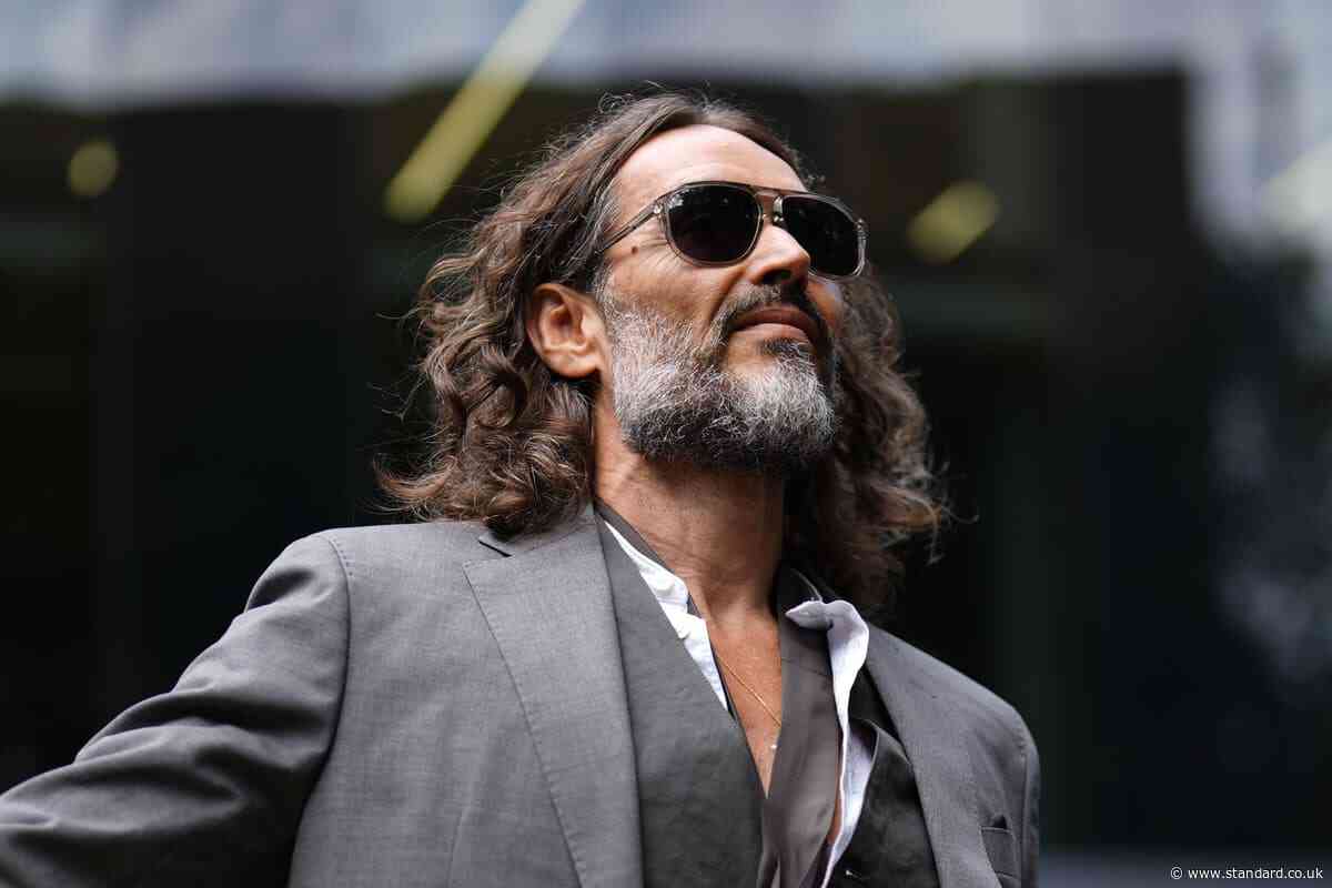 Russell Brand arrives at court for hearing ahead of rape trial