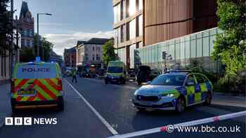 Two men charged after city centre stabbing