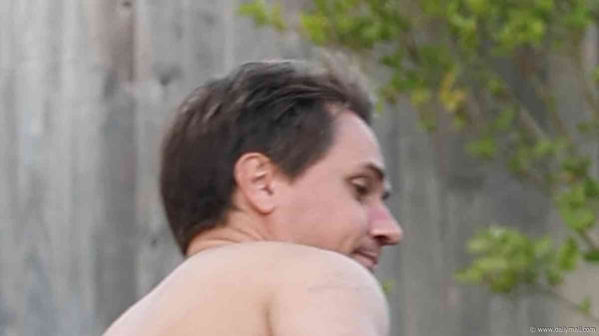 The Inbetweeners' Simon is seen running out of his house in his underwear as he's threatened with a golf club by jealous love rival during filming for the new movie