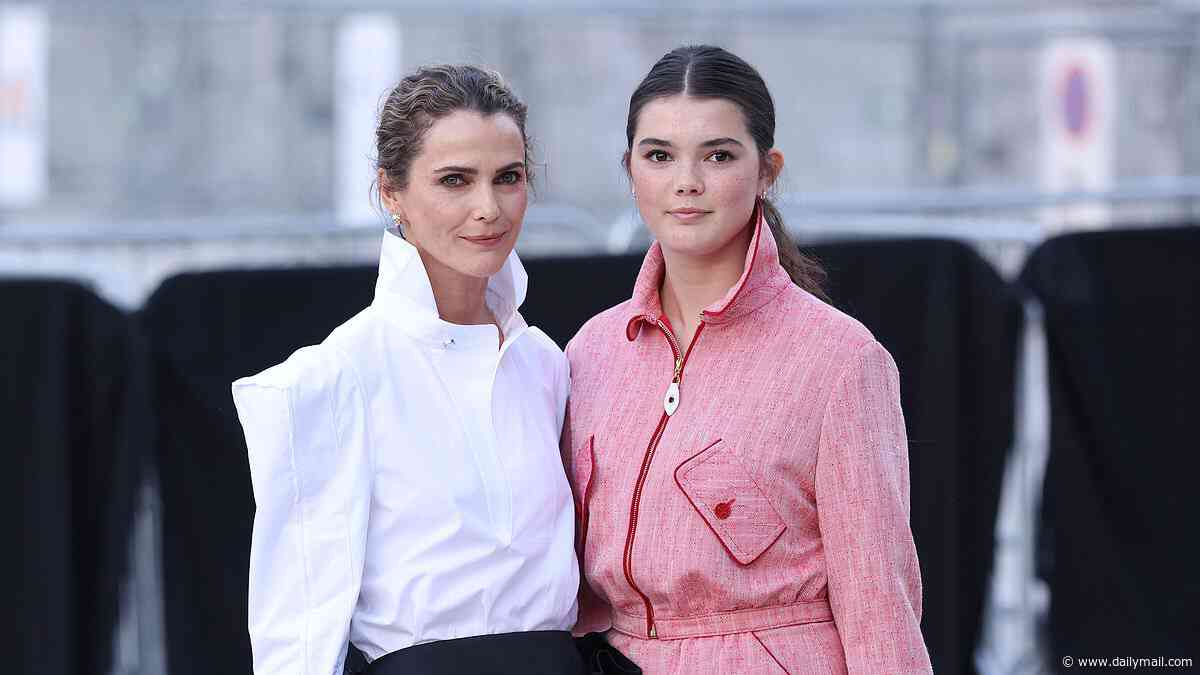 Keri Russell, 50, looks chic in a white shirt and black box skirt as she enjoys rare outing with her mini-me daughter Willa, 13, at the Louis Vuitton show during Paris Fashion Week