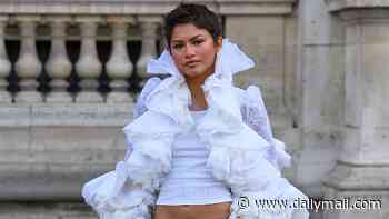 Zendaya puts on a stylish display in a white bolero jacket and jeans as she makes her first Fashion Week appearance for the Louis Vuitton show in Paris