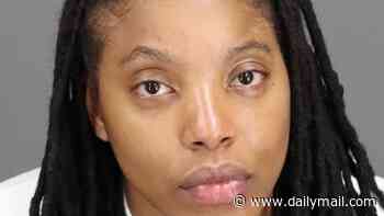 Female cop looks glassy-eyed in mugshot after she allegedly drove drunk wrong way down road and crashed into car