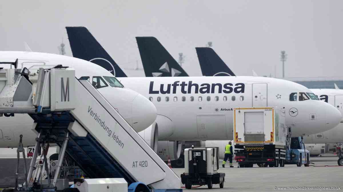 Passenger who 'tried to open plane door' mid-air restrained by crew in dramatic incident