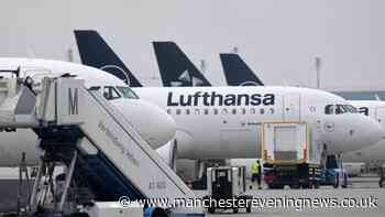 Passenger who 'tried to open plane door' mid-air restrained by crew in dramatic incident