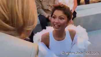 Zendaya is criticised for lacking 'basic manners' as she remains seated to greet Brigitte Macron at Louis Vuitton show in Paris