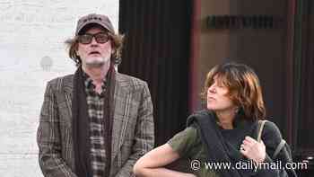 Pulp's Jarvis Cocker makes rare appearance with wife Kim Sion as they enjoy a designer shopping spree at Gucci