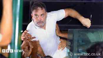 India's opposition leader dragged on to bus as police break up protest