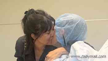 Kourtney Kardashian passionately kisses Travis Barker in hospital as he poses before mystery surgery