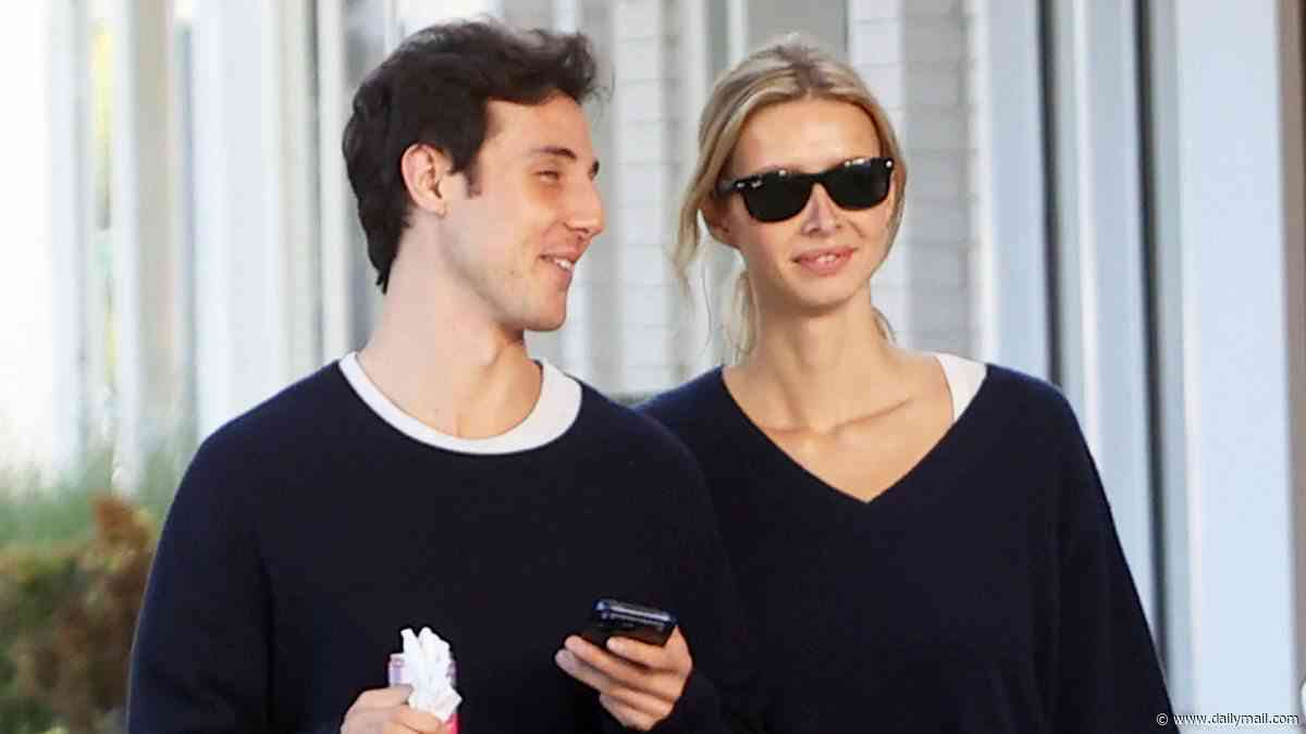 Gwyneth Paltrow's mini-me daughter Apple Martin keeps her philanthropist boyfriend Moshe Levi close on romantic stroll