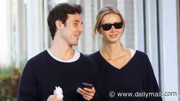 Gwyneth Paltrow's mini-me daughter Apple Martin keeps her philanthropist boyfriend Moshe Levi close on romantic stroll