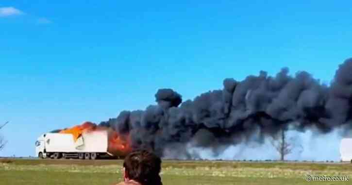 Moment Russian supply trucks speed away in flames from Ukrainian drone strikes