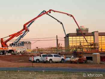 Crews pour concrete on May Avenue bridge
