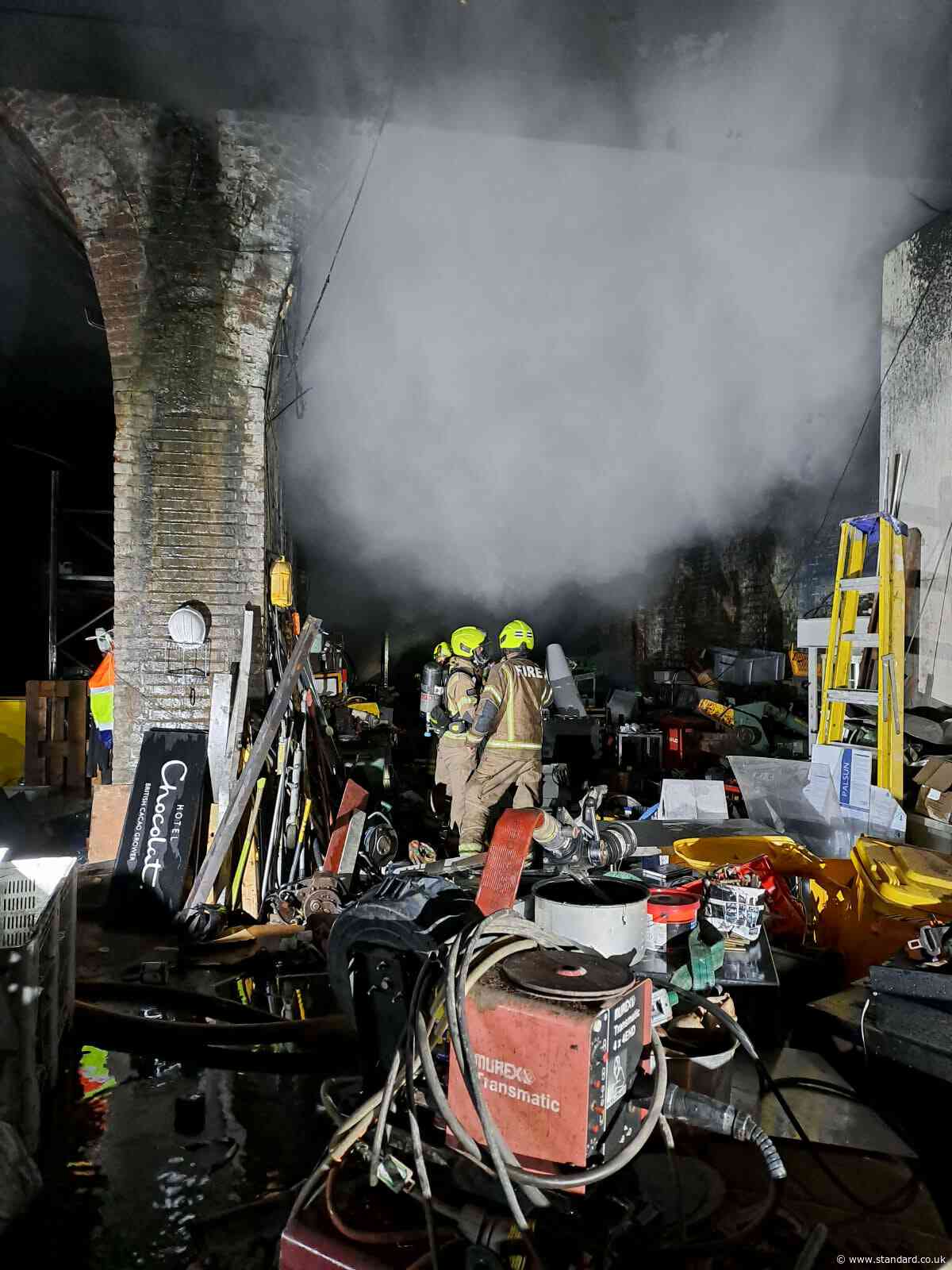 Firefighters battle gas cylinder blaze under London railway arches