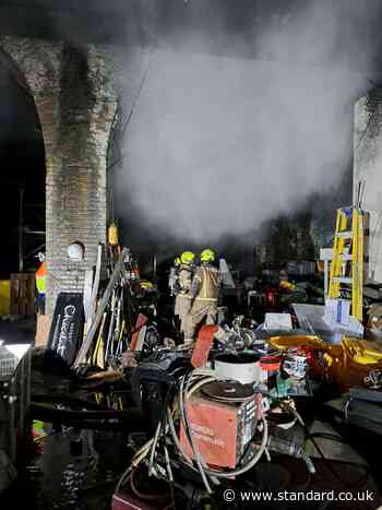 Firefighters battle gas cylinder blaze under London railway arches