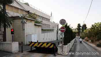 Workers remove signage from British consulate in Jerusalem after Israel ordered it to close after Labour announced West Bank sanctions