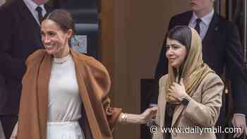Meghan steps into the limelight: Duchess leaves Claridge's wearing £28,000 outfit accompanied by Malala Yousafzai after afternoon tea