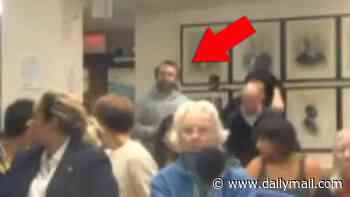 Journalist filmed lashing out at Cornell city council during fiery meeting and shouts that they've failed to afford gang rape accused any due process