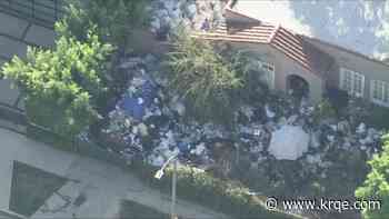 L.A. neighborhood's infamous ‘trash house’ buried in garbage again