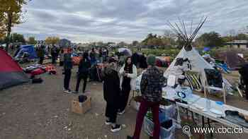 Police, fire department move in to clear Saskatoon encampment