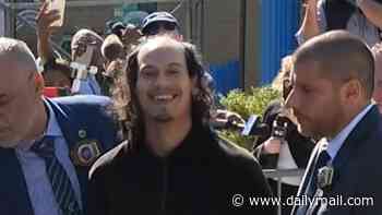 Face of evil: Laughing boyfriend smirks as he's arrested for pushing girlfriend and baby off 15th floor balcony