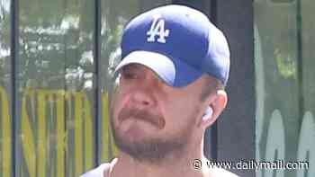 Minka Kelly's ex Dan Reynolds emerges looking heartbroken in public following the couple's shock split