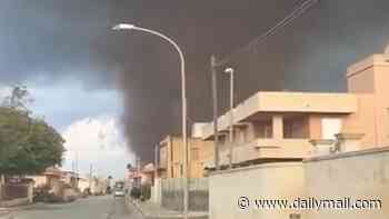 Moment tornado rips through Sicilian tourist hotspot flipping cars days as Europe is lashed by storms and flooding