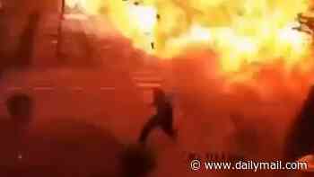 Seconds from death: Moment Ukrainian sprints from path of incoming Russian drone before it lands yards away in huge fireball explosion