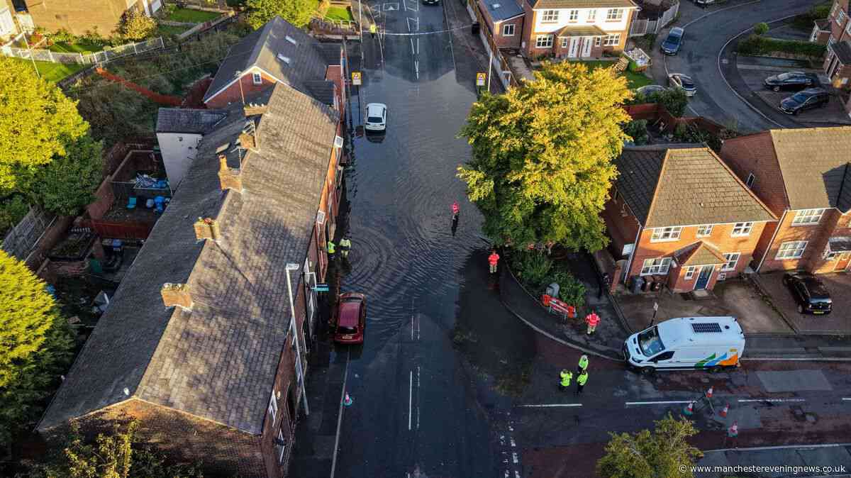 Emergency services scrambled as 'severe' flooding turns Oldham residential street into lake