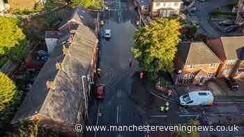Emergency services scrambled as 'severe' flooding turns Oldham residential street into lake