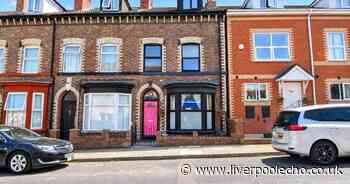 Birkenhead home's bright pink door gives a hint of what is behind it