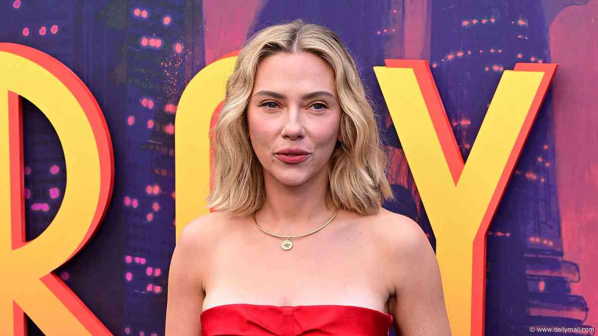 Scarlett Johansson stuns in a strapless red dress which shows off her huge back tattoos as she attends the Ray Gunn premiere during the BFI London Film Festival