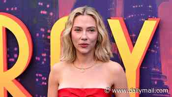 Scarlett Johansson stuns in a strapless red dress which shows off her huge back tattoos as she attends the Ray Gunn premiere during the BFI London Film Festival