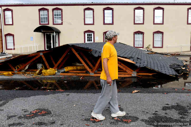 Isaias weakens but flooding threat persists as hundreds of thousands grapple with power outages