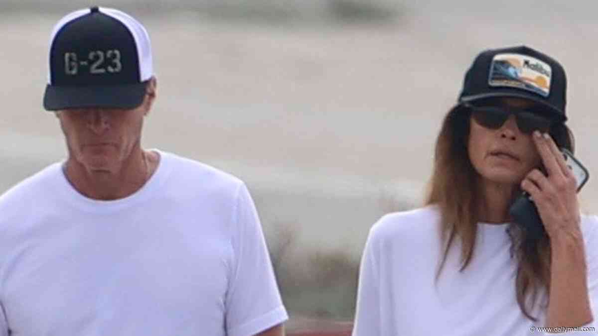 Cindy Crawford and Rande Gerber hold hands on beach in somber outing three weeks after son Presley died aged 27 at rehab facility