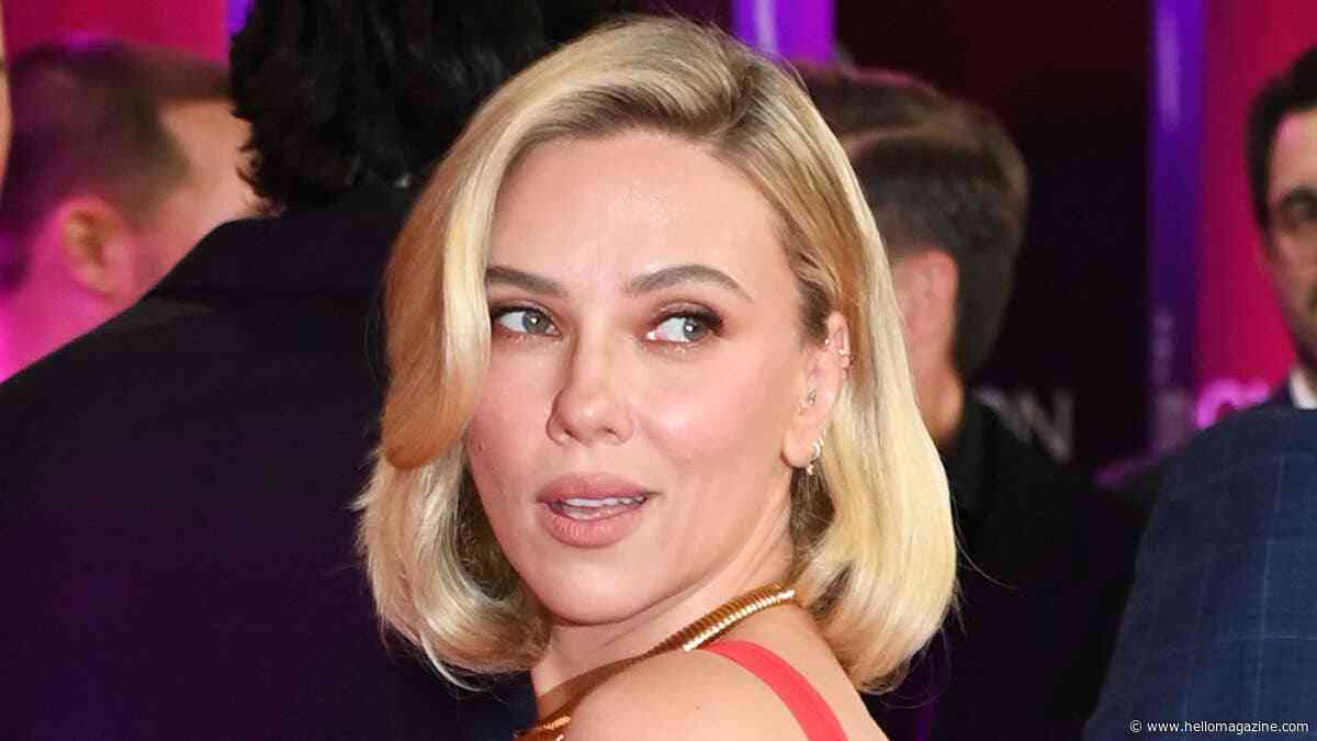 Scarlett Johansson, 41, showcases huge tattoos in stunning red gown