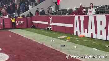 Alabama fans launch bottles at rival Georgia players after controversial ending to defeat