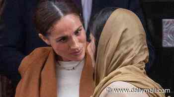 A 'gracious duchess' ritual and the 'intentionally intense' hug: Meghan's 'dramatic' embrace with Malala was bid to grab attention as she made first public appearance in UK since Queen's funeral, experts say