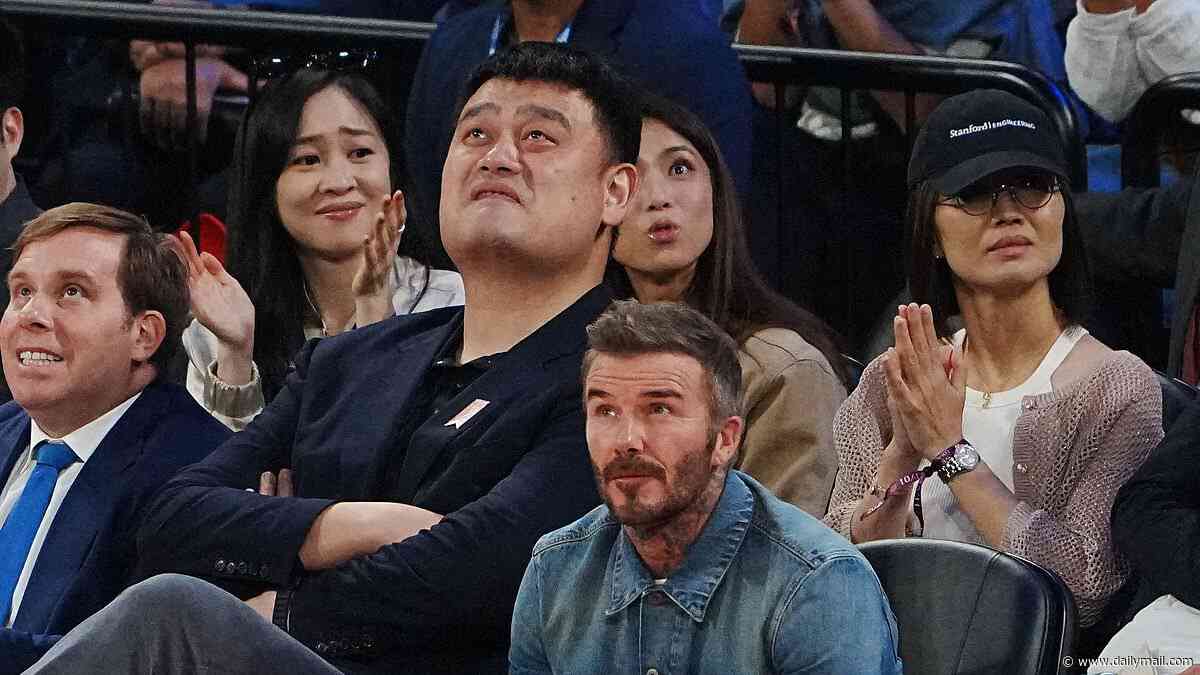 David Beckham is dwarfed by 7ft 6in basketball player Yao Ming as he enjoys game in China