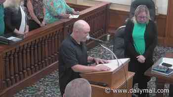 Small-town Iowa council meeting is opened by resident praying to Satan before stunned members scramble to 'reverse the curse'