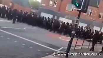 Hooded protesters march to Sheffield bus depot in early hours