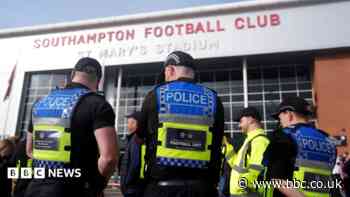 Officer injured as football fans pull down barriers