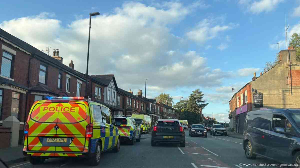 Police descend on Rochdale street after 'altercation' leaves man injured